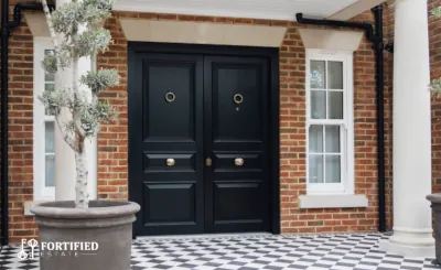A set of bullet resistant casement windows in a bedroom