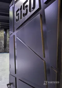 Custom black security door indoors